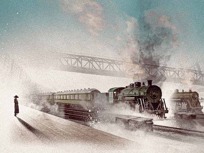 A woman stands on a platform at the train station.